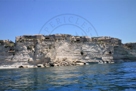 Delimara Fortress in Marsaxlokk Bay, Malta. The erosion of the coast is threatening this specific built heritage which is close to a potential collapse due to the disappearance of the cliff. While it could be a clear cause of climate change affecting maritime cultural heritage, some fishermen attribute the cause to the construction of the free port on the other side of the bay, which influenced the sea currents and the tides, causing the actual damage to the coastal landscape. The access to Delimara Fortress is closed while further discussions are still need to be done to decide the future of this historical site (Photo: Jordi Vegas Macias).