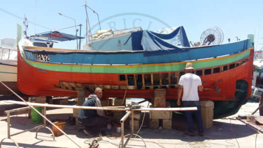 Marsaxlokk, Malta. In Marsaxlokk, it is common to see fishermen with some relatives and friends fixing their traditional vessels. The Boat Restoration Scheme is a national policy from fisheries that encourages the restoration of the Luzzu, Kajjikk, Ferilla and Fregatijna. The aim is to support the small-scale fishermen in Malta but it also acknowledges the traditional and cultural importance of the boats as part of the Maltese heritage (Photo: Jordi Vegas Macias).