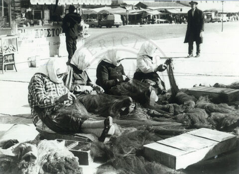 Professional net mending, Kavala harbor, Greece